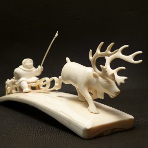 Rentierschlitten mit Husky